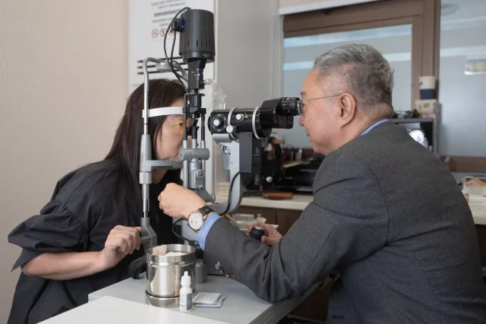 Dr Christopher Khng performing cataract screening at EyeWise Vision Clinic