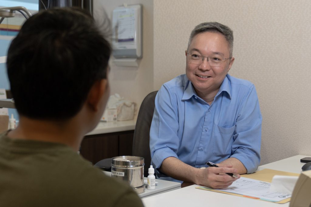 Patient consultation with Dr Christopher Khng at EyeWise Vision Clinic